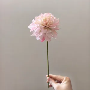 Artificial pink dahlia flower stem detail shot, vintage silk floral for DIY crafts and decor.