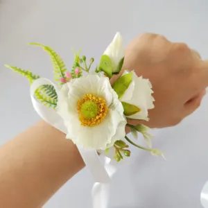 Fleur de poignet artificielle coquelicot et rose pour mariée, élégant ruban blanc.