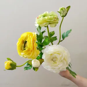 Close-up detail of artificial camellia flower branch, multi-head silk floral decor for photography props.