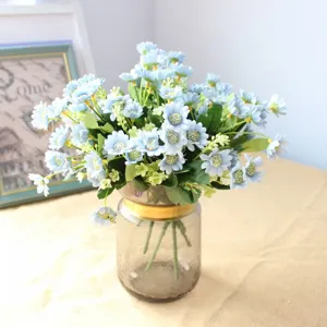 Artificial star daisy flowers in glass vase detail view for home decor and DIY crafts.