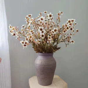 Artificial chamomile flower detail, faux wild daisy bouquet for home decor and vase display.