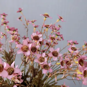 Detailed close-up of vintage pink artificial chamomile flowers, ideal for home decor arrangements.