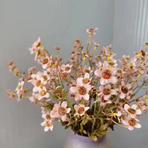 Details of pink artificial wild chrysanthemum bouquet, silk autumn flower home decor.