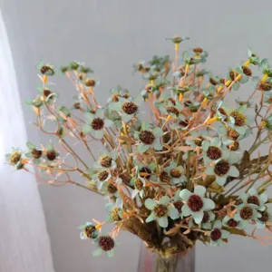 Detailed close-up view of autumn style artificial chamomile wild flowers for home decor.