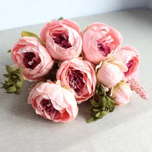 Detailed close-up of pink artificial peony flower bouquet showing delicate petal textures.