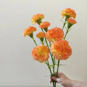 Artificial orange carnations fake silk flowers bouquet for home wedding decoration.