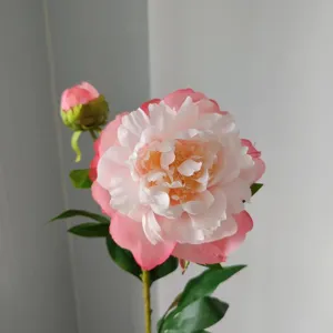 Exquisite artificial peony flower detail featuring dual pink and white gradient blooms and leaves.