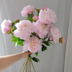 Artificial pink peony flower bouquet detail view, elegant silk floral home decoration.