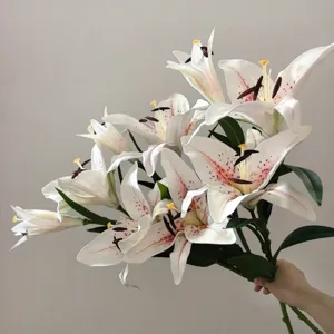 Detail view of realistic artificial lily bouquet with soft touch, ideal for home decor.
