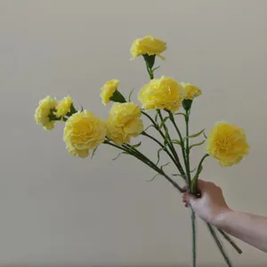 Artificial yellow carnations bouquet for home decor, wedding arrangement and festival gifting.