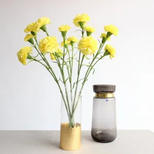 Yellow artificial carnations flowers bouquet for home wedding party decoration items.