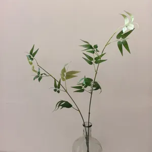Artificial Qinshi bamboo leaf detail shot, elegant green plant decor for tea room and home.