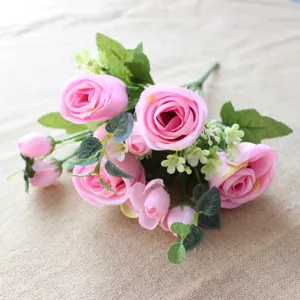 Close up of artificial pink rose and eucalyptus bouquet detail, perfect for home decor.