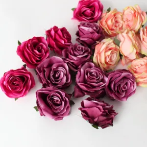 Artificial silk rose heads for DIY crafts, wedding decorations, and hat accessories.