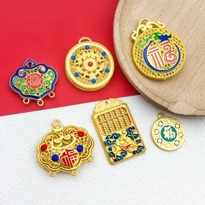 Details of vintage gold alloy DIY jewelry charms, featuring hollow longevity locks and abacus.