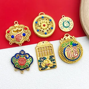 Detailed close-up of Chinese traditional style gold alloy DIY jewelry charms and pendants.