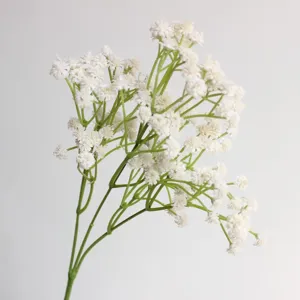 Artificial white baby breath flower single branch detail for wedding floral decoration.