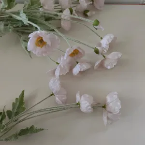 Detailed view of artificial poppy flowers, flocked silk poppy stems for home decor and props.