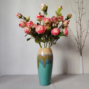 Artificial rose flower bouquet detail view ceramic gradient vase interior decor display.