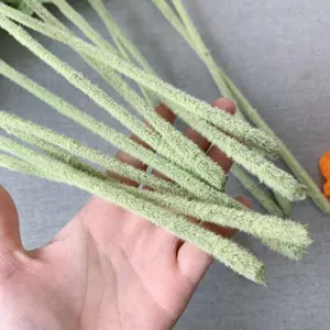 Artificial poppy flower stems detail showing green fuzzy flocking texture for home decor.