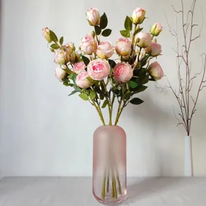 Artificial pink rose flower bouquet in frosted glass vase home decor photography props.