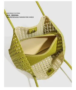 Detailed view highlighting the interior structure and woven texture of the green shoulder bag.