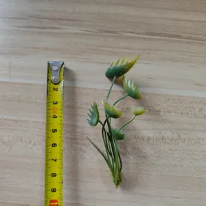 Small artificial green leaves for DIY crafts, floral arrangements, and handmade corsage accessories.