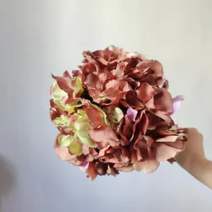 Detailed close-up of artificial retro pink hydrangea silk flower head for elegant home decor.