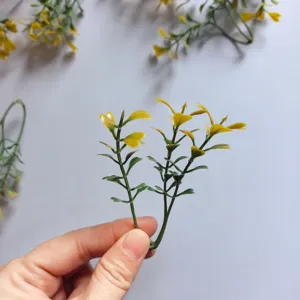 Small green PVC artificial leaves for DIY craft, corsage, and hat decoration.