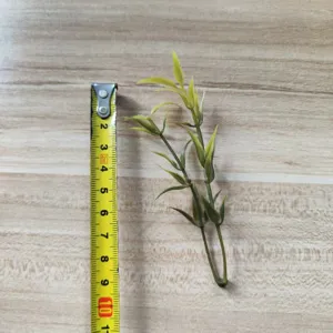 Green PVC artificial leaf branch for DIY handmade corsage wrist flower hat decor detail view