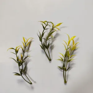 Small PVC artificial leaves detail, green plant flower arrangement and DIY craft accessory.