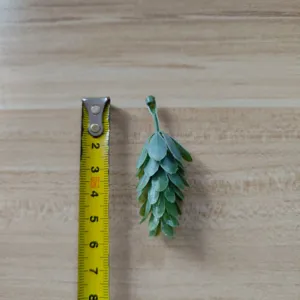 Green PVC artificial leaf craft accessory for DIY floral decoration, detailed view.