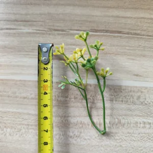 Artificial green leaf branch for DIY crafts, floral arrangement, and hat decoration.