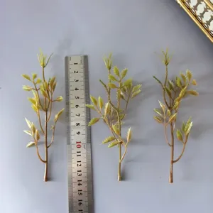 Close-up detail of artificial green leaf stems for DIY crafts and floral arrangements.