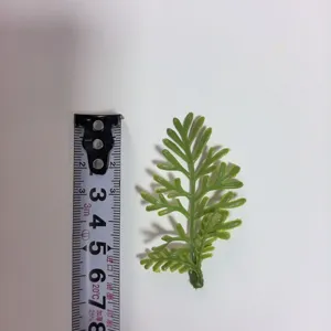 Green PVC artificial leaf detail for DIY craft floral arrangement and corsage accessories.