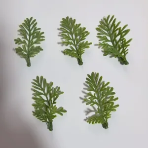 Small green PVC artificial leaves detail, ideal for DIY corsages, wrist flowers and craft projects.