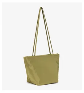 Olive green shoulder bag detail, lightweight nylon fabric, minimalist daily accessory.