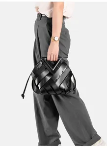 Black woven leather handbag, stylish top handle bag with unique clasp design for women.