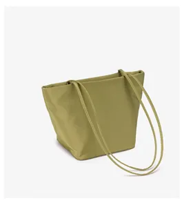Detailed view of the olive green minimalist nylon hobo shoulder bag with thin straps.