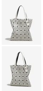 Detail view of the stylish white geometric lattice tote bag showing exquisite texture and straps.