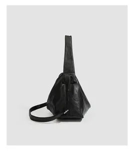 Minimalist black soft leather shoulder crossbody bag, stylish daily versatile handbag for women.