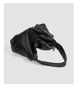 Minimalist black soft leather shoulder bag for women, large capacity slouchy hobo crossbody.