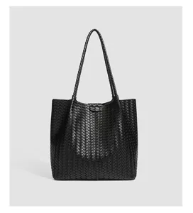 Black woven leather tote bag detail, featuring classic intrecciato design and large capacity.