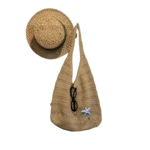 Borsa hobo in maglia traforata estiva con cappello di paglia, borsa a tracolla da spiaggia.