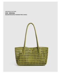 Green woven leather tote bag for women, stylish minimalist shoulder bag for daily casual use.