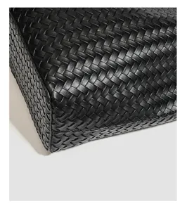 Black woven leather tote bag detail closeup classic handmade fashion accessory daily commuting