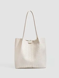 Off-white woven tote bag with large capacity, elegant single shoulder design for daily use.