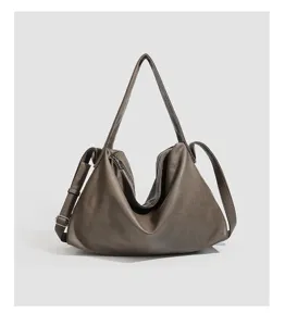 Soft leather slouchy hobo shoulder bag detail, minimalist daily casual crossbody design.