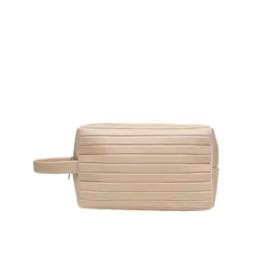 Beige travel toiletry bag portable cosmetic makeup organizer waterproof storage pouch.