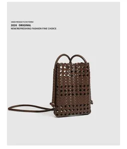 Brown woven leather mini phone bag, stylish soft crossbody pouch for women daily use.